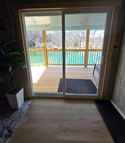 a picture from inside one of our cabins looking out over the pond